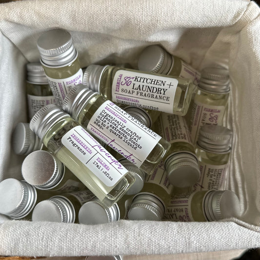 lavender kitchen and laundry fragrance vials in a basket with linen liner