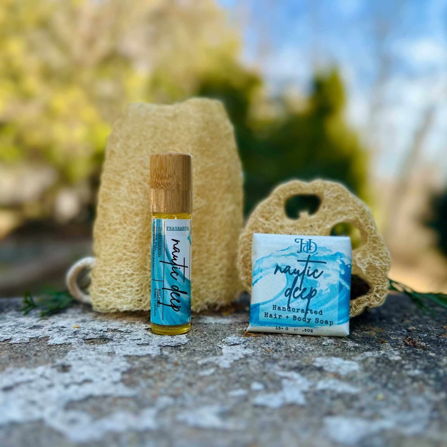 Skincare products with natural elements on a stone surface