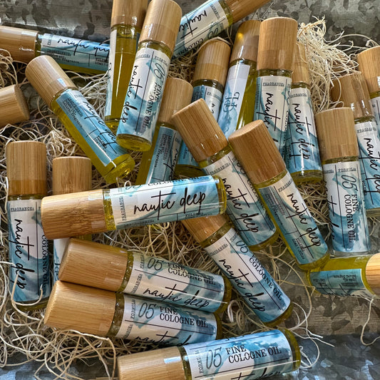 Collection of small bamboo bottles labeled 'nautic deep' on a textured surface.