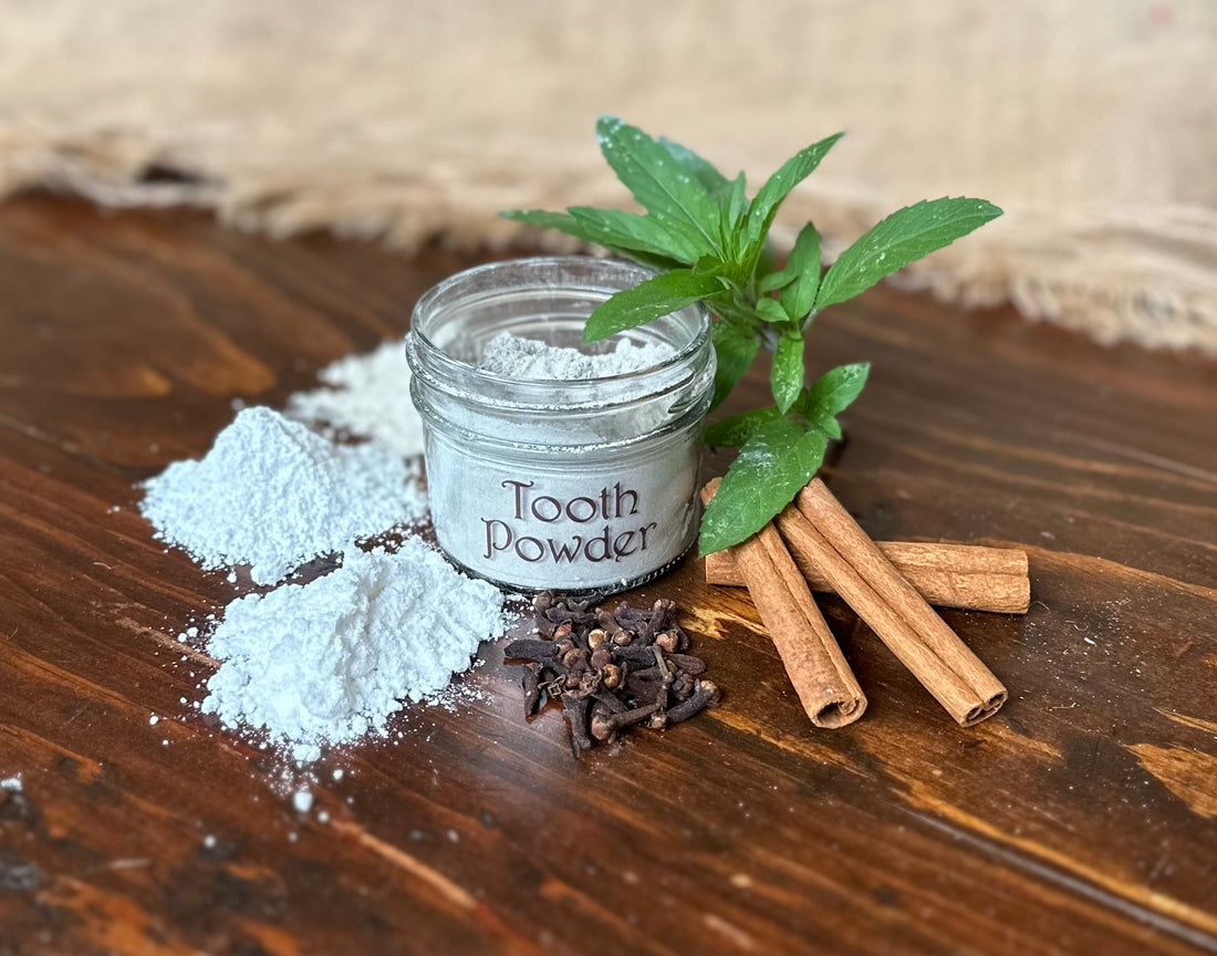 Visual of toothpaste powder ingredients surrounding a jar on a wooden table with burlap background