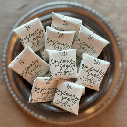 miniature rosemary and sage soaps in a silver bowl 