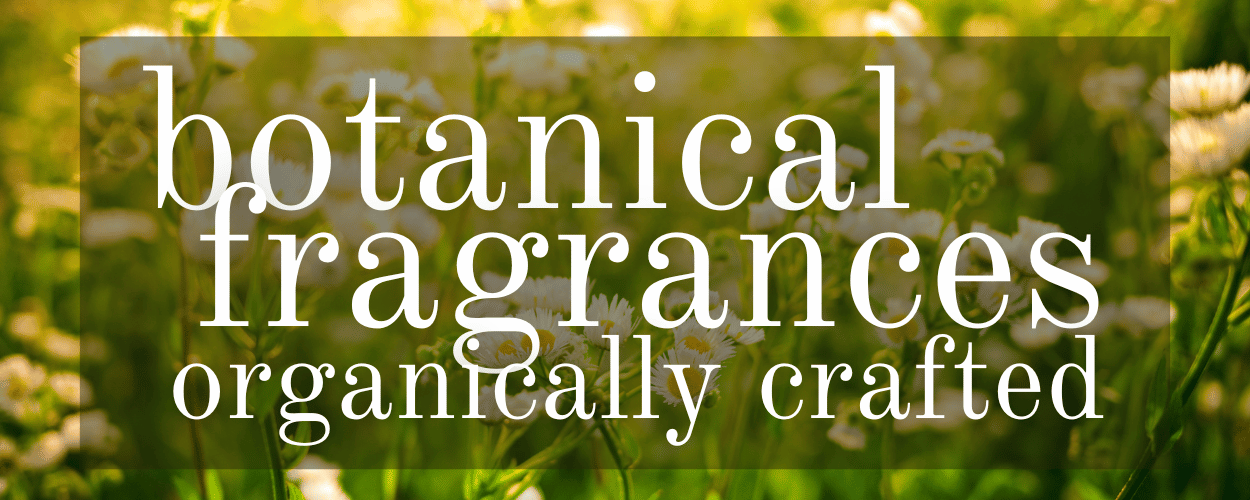 Text 'botanical fragrances organically crafted' over a blurred natural background of yellow and white daisies.