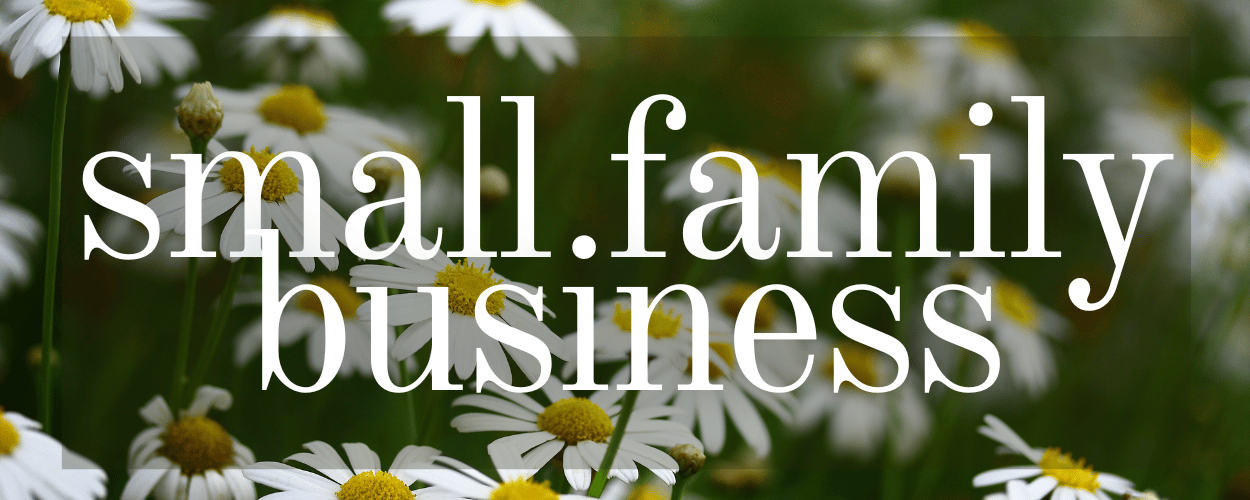 Text 'small family business' over a background of daisies