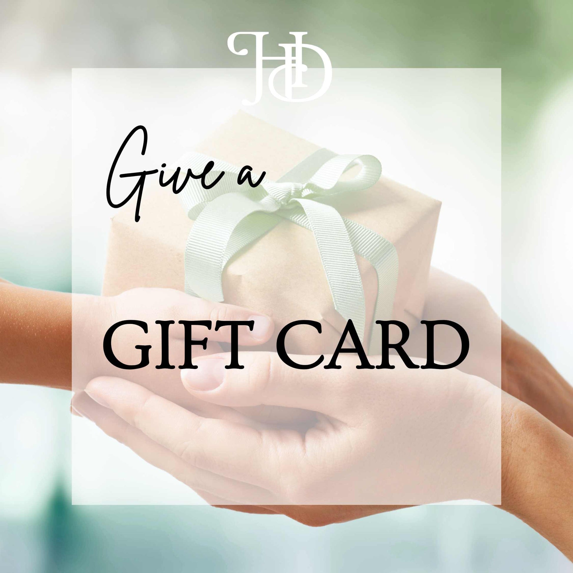 Two hands holding a gift card with a ribbon, overlaid text 'Give a GIFT CARD', and a blurred background.