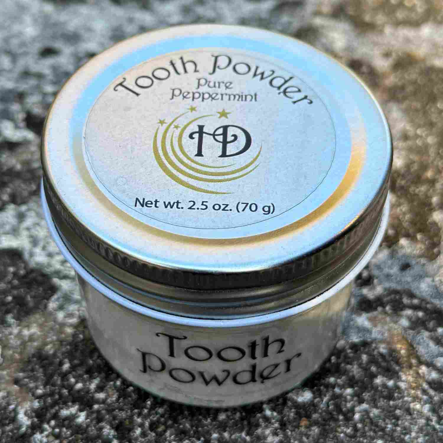 All Natural Mineral Large Pure Peppermint Tooth Powder Jar Top and Front on Stone Bench