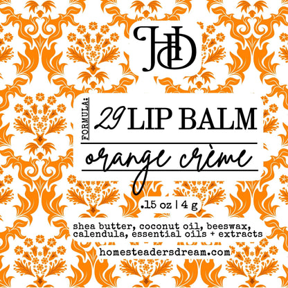 Orange creme lip balm packaging with orange and white floral pattern and 'HD' branding.