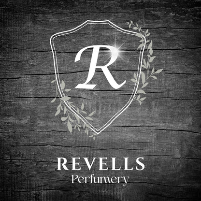 Revells Perfumery logo on a wooden background