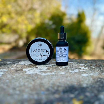 Beard balm and oil with dropper on a stone surface outdoors