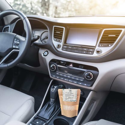 Car interior with a coffee bag on the dashboard