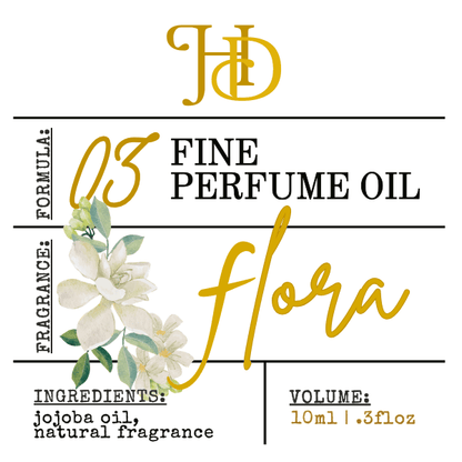 Perfume oil label with floral design and branding details on a white background