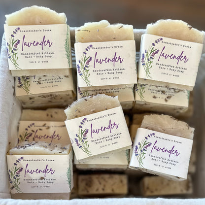 Handcrafted lavender soap bars with labels in a box