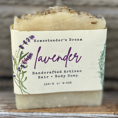 Handcrafted artisan lavender soap with a label on a wooden surface