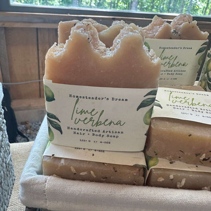 Handcrafted artisan lime verbena soap bars with linen paper wrap in a woven basket.