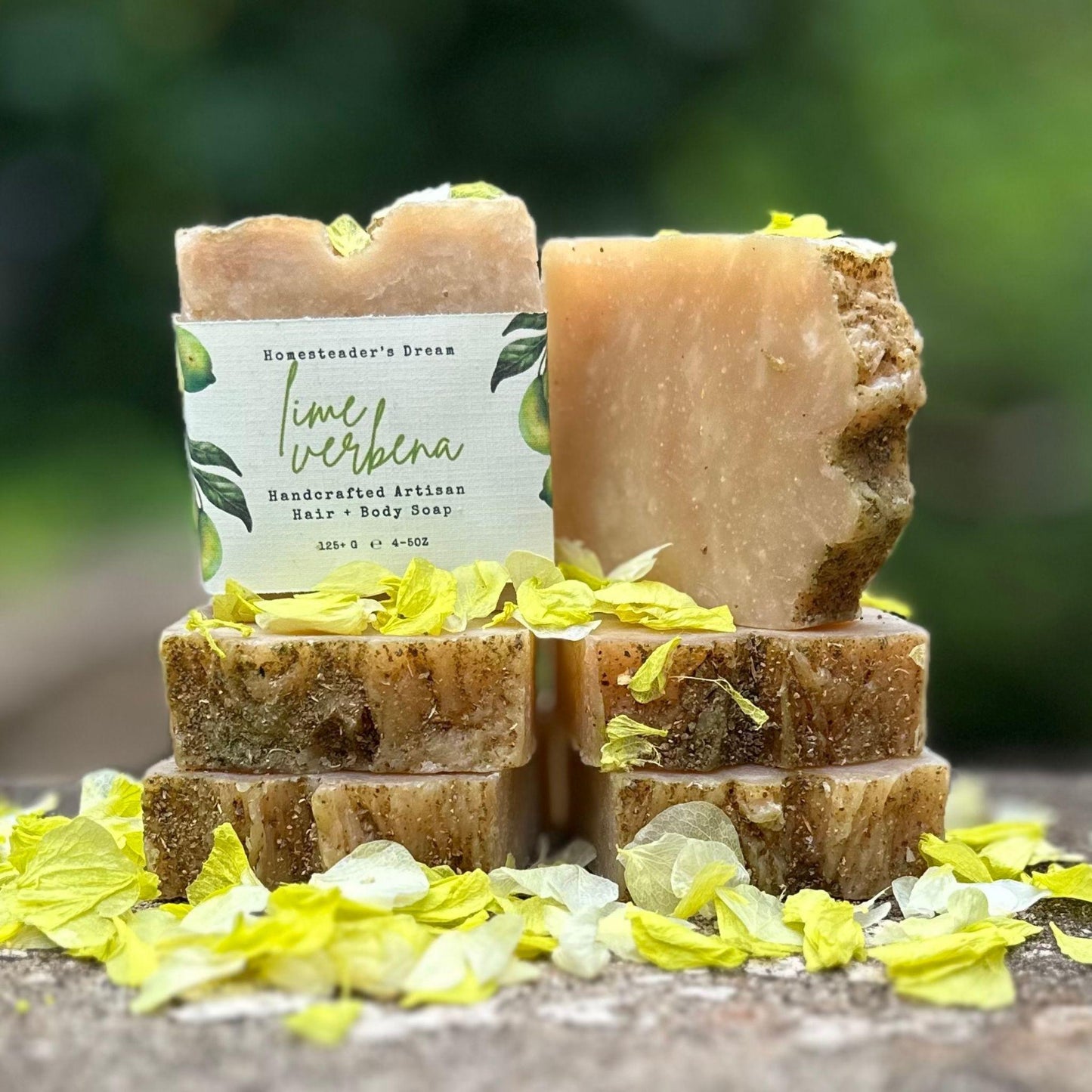 Stack of 6 lime verbena handmade soap bars with a linen paper label on a natural background