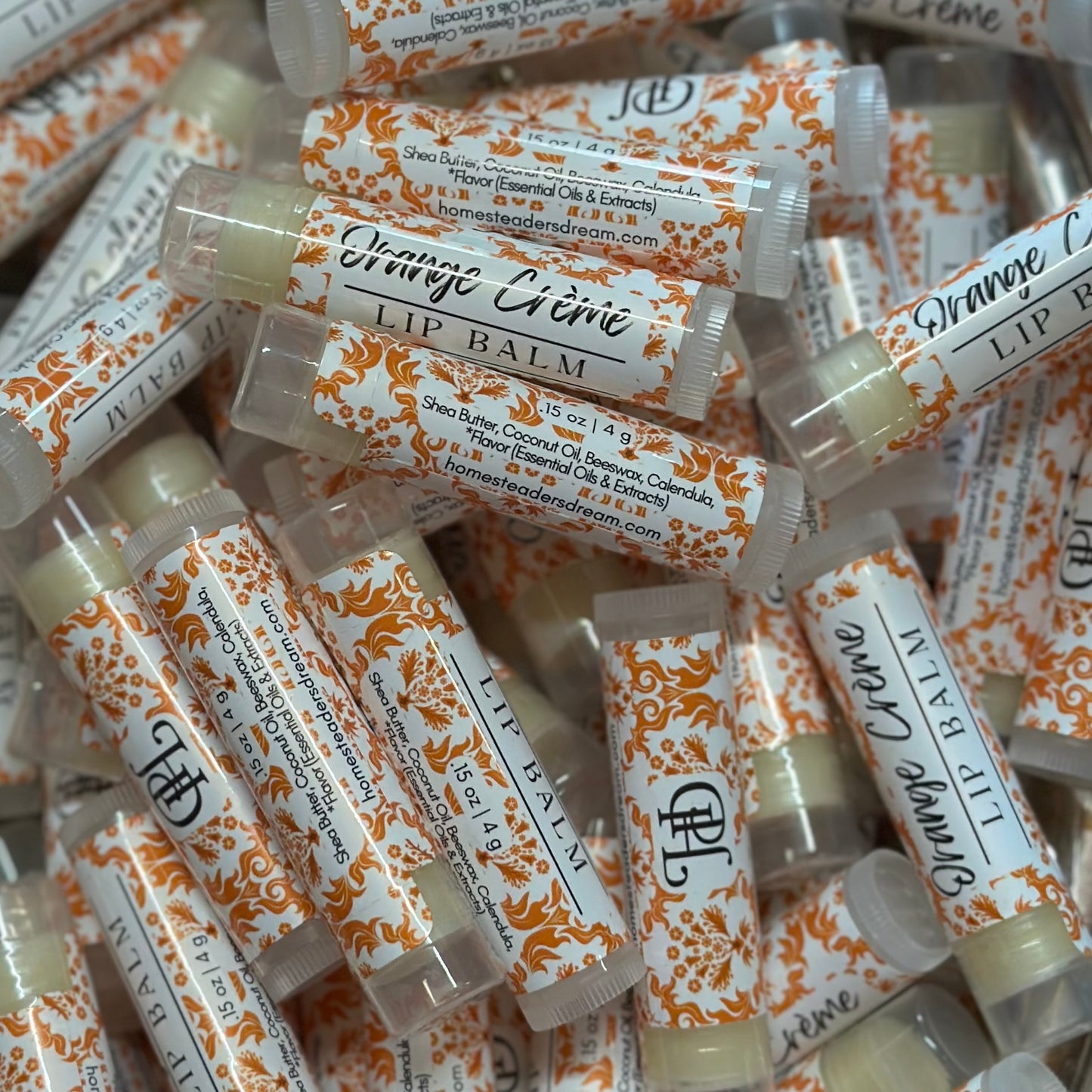 orange creme lip balm pile