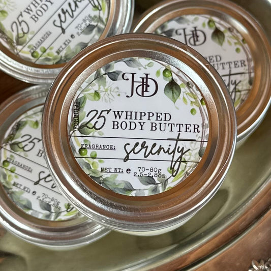 Jars of fragrance-free whipped body butter labeled 'Serenity' with decorative labels.
