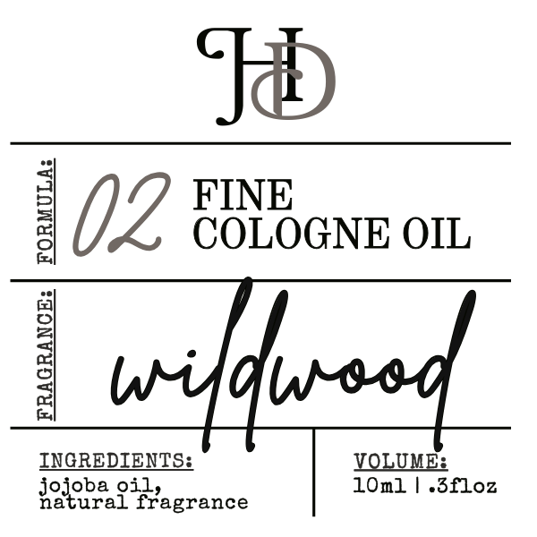 Label for Fine Cologne Oil Wildwood with branding and product details.