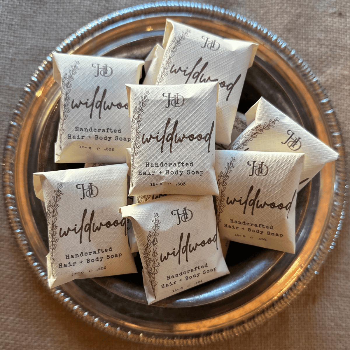 silver bowl full of wrapped wildwood guest soap bars